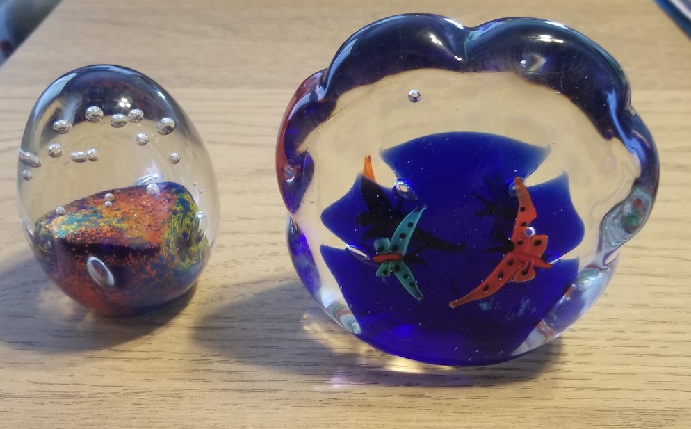 2 local paperweights